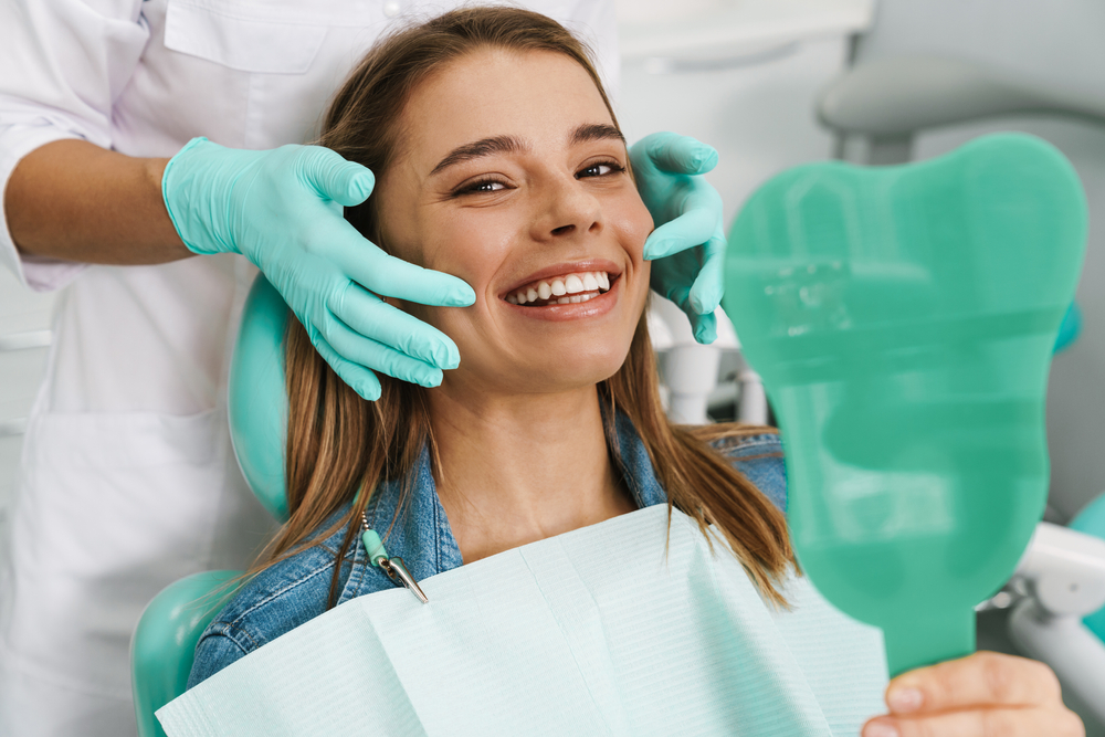 Adult patient in a dental clinic learning cavity prevention tips