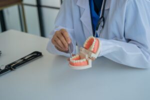 Dentist consulting with patient about teeth replacement options